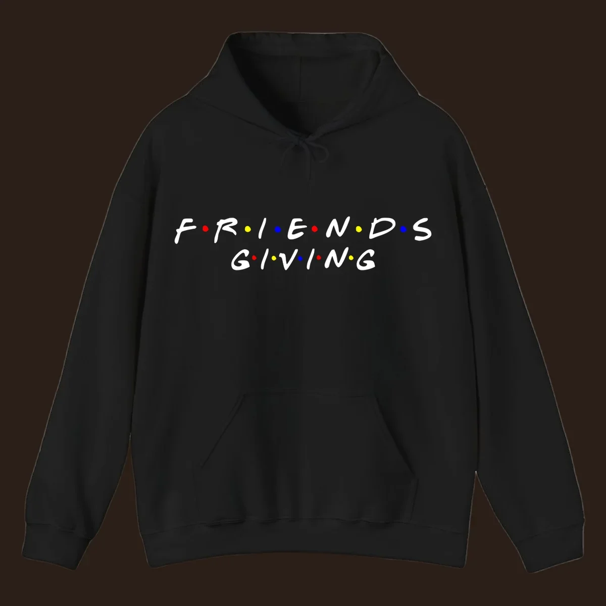 Friendsgiving typography design in white with red, yellow, and blue dots.