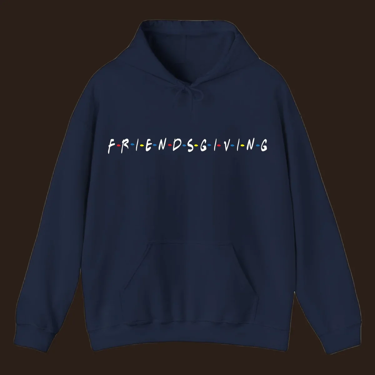 Friendsgiving typography design with white letters and colored dots on a black background.