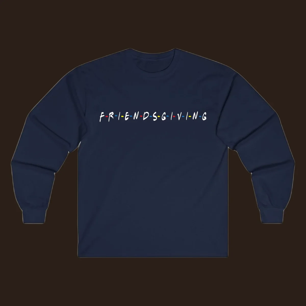 Friendsgiving typography design with white letters and colored dots on a black background.