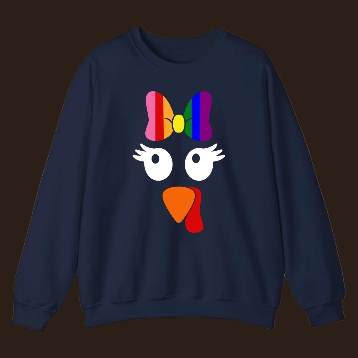 Rainbow turkey face with a bow, graphic for Thanksgiving.