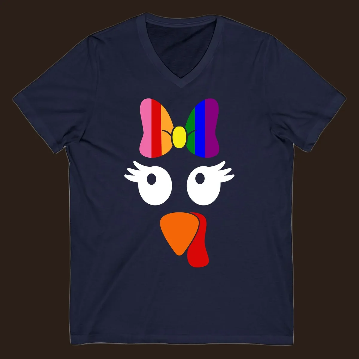 Rainbow turkey face with a bow, graphic for Thanksgiving.