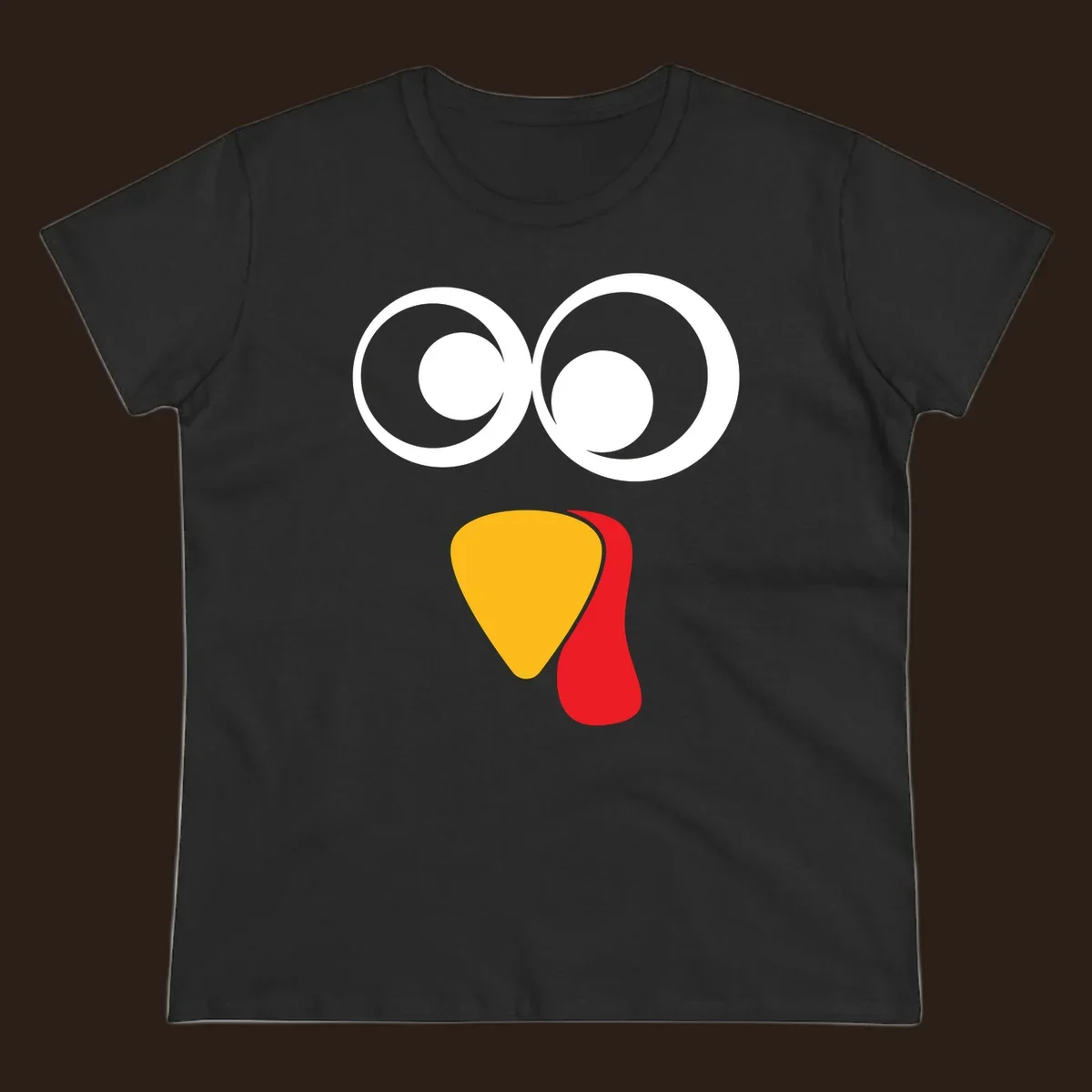 Googly-eyed turkey face illustration with yellow beak and red wattle.