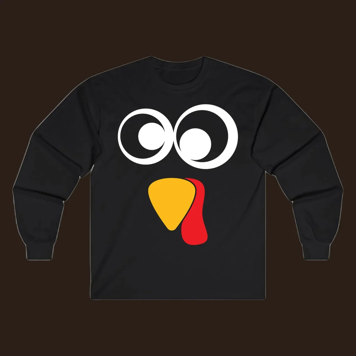 Googly-eyed turkey face illustration with yellow beak and red wattle.