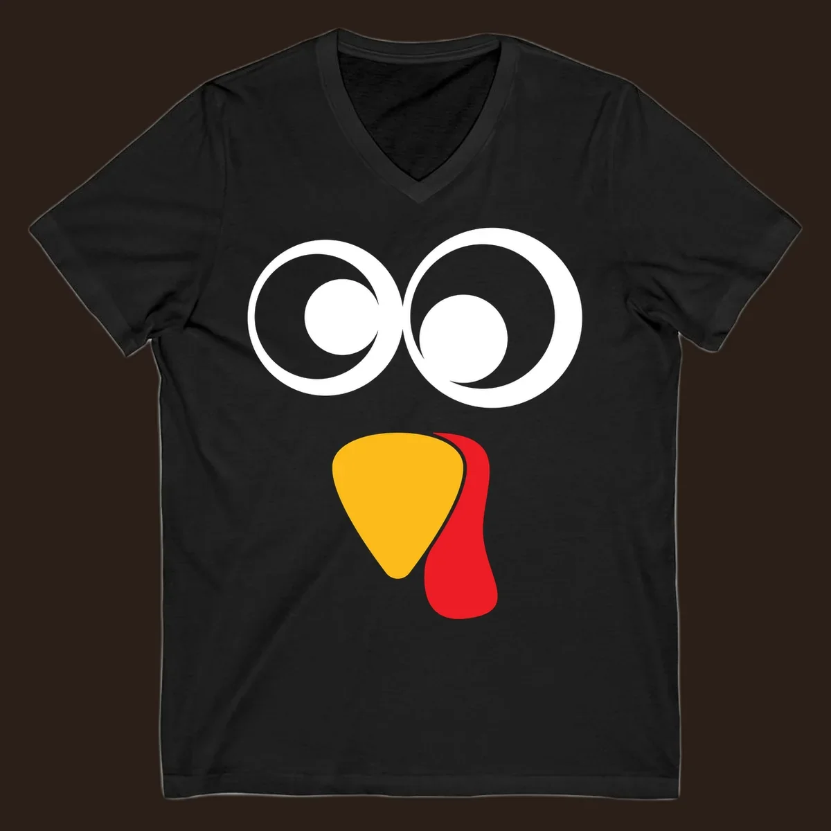 Googly-eyed turkey face illustration with yellow beak and red wattle.