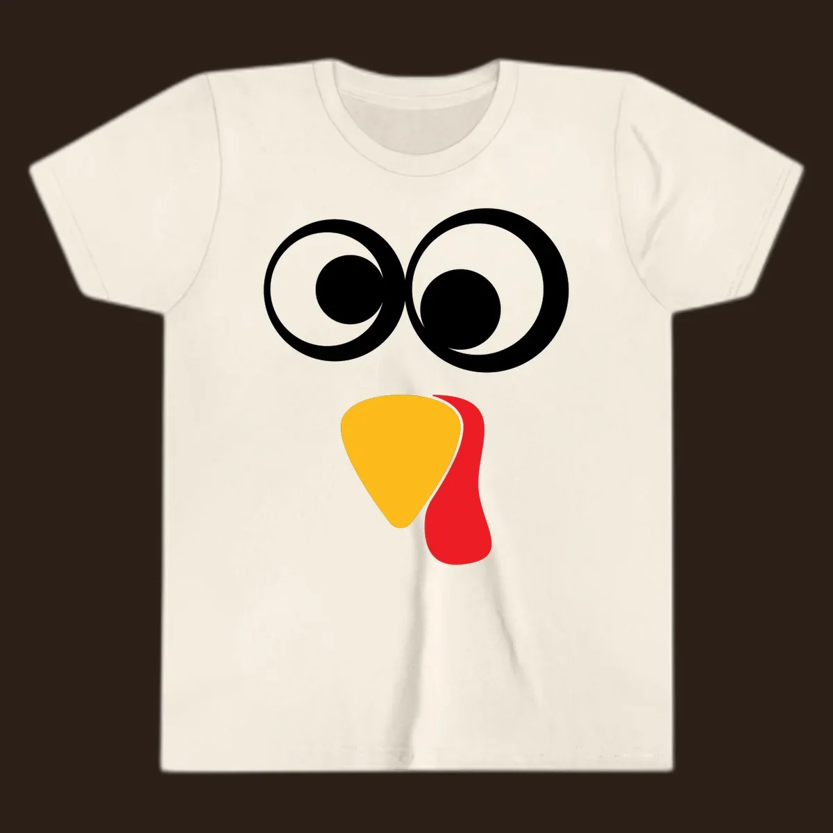 Googly-eyed turkey face illustration with yellow beak and red wattle.
