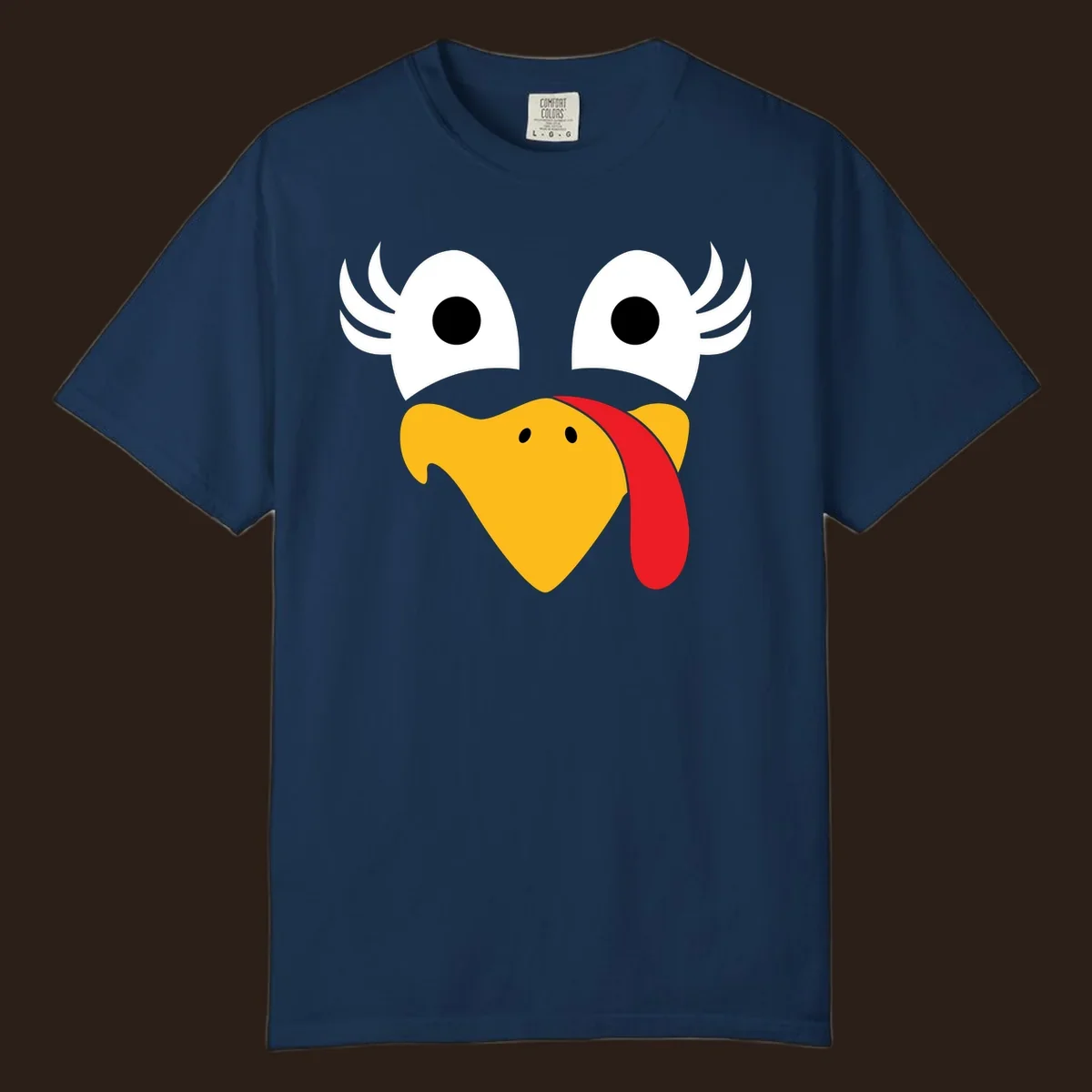 Funny turkey face illustration with googly eyes and a red wattle, for Thanksgiving.