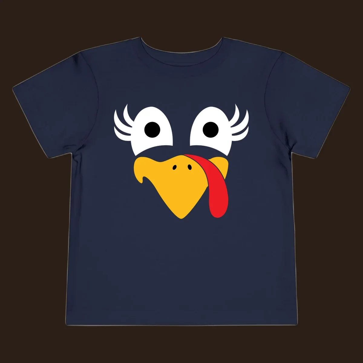Funny turkey face illustration with googly eyes and a red wattle, for Thanksgiving.