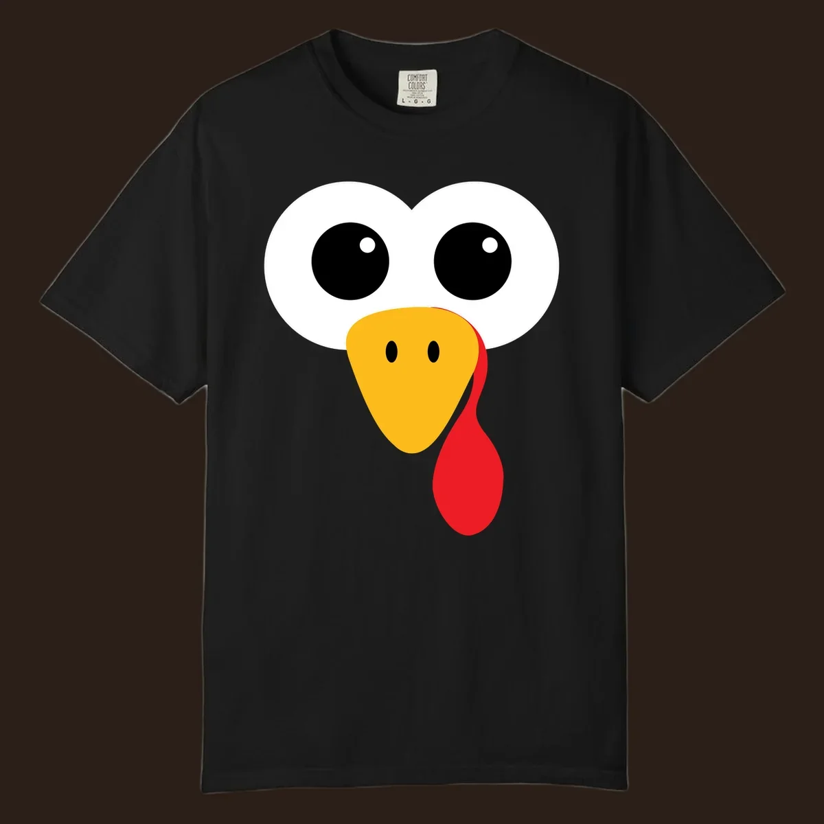 Funny turkey face with googly eyes, yellow beak, and red wattle for Thanksgiving.