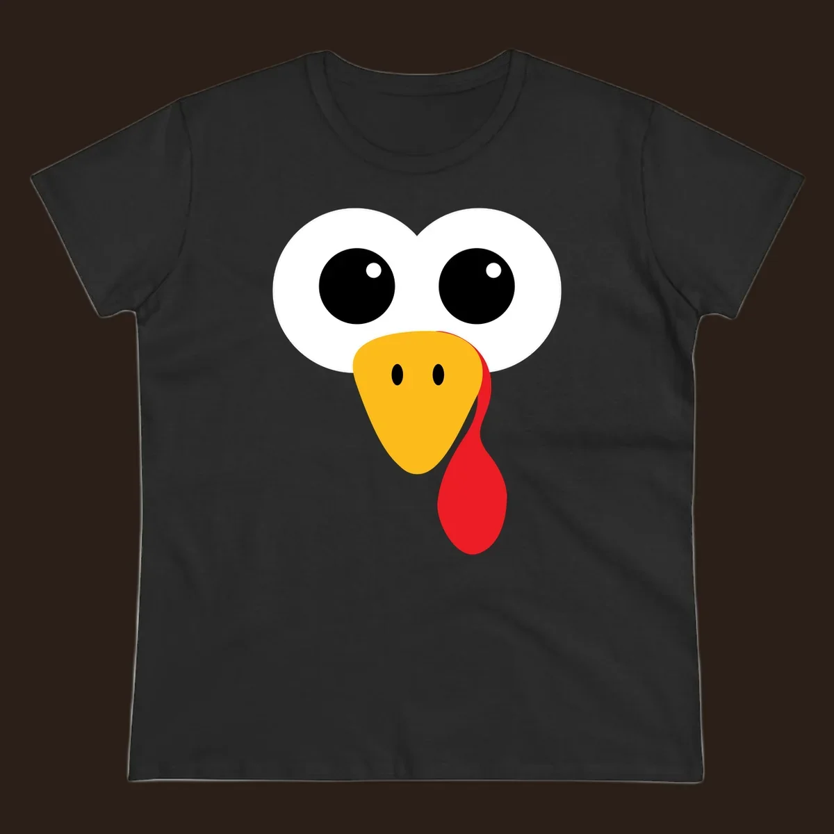 Funny turkey face with googly eyes, yellow beak, and red wattle for Thanksgiving.