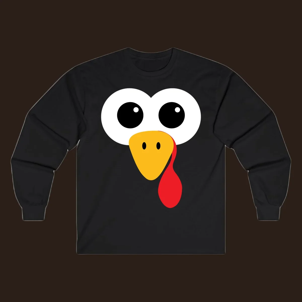 Funny turkey face with googly eyes, yellow beak, and red wattle for Thanksgiving.