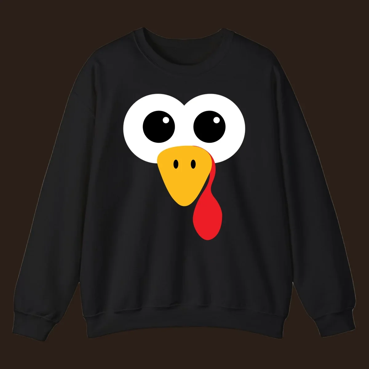 Funny turkey face with googly eyes, yellow beak, and red wattle for Thanksgiving.