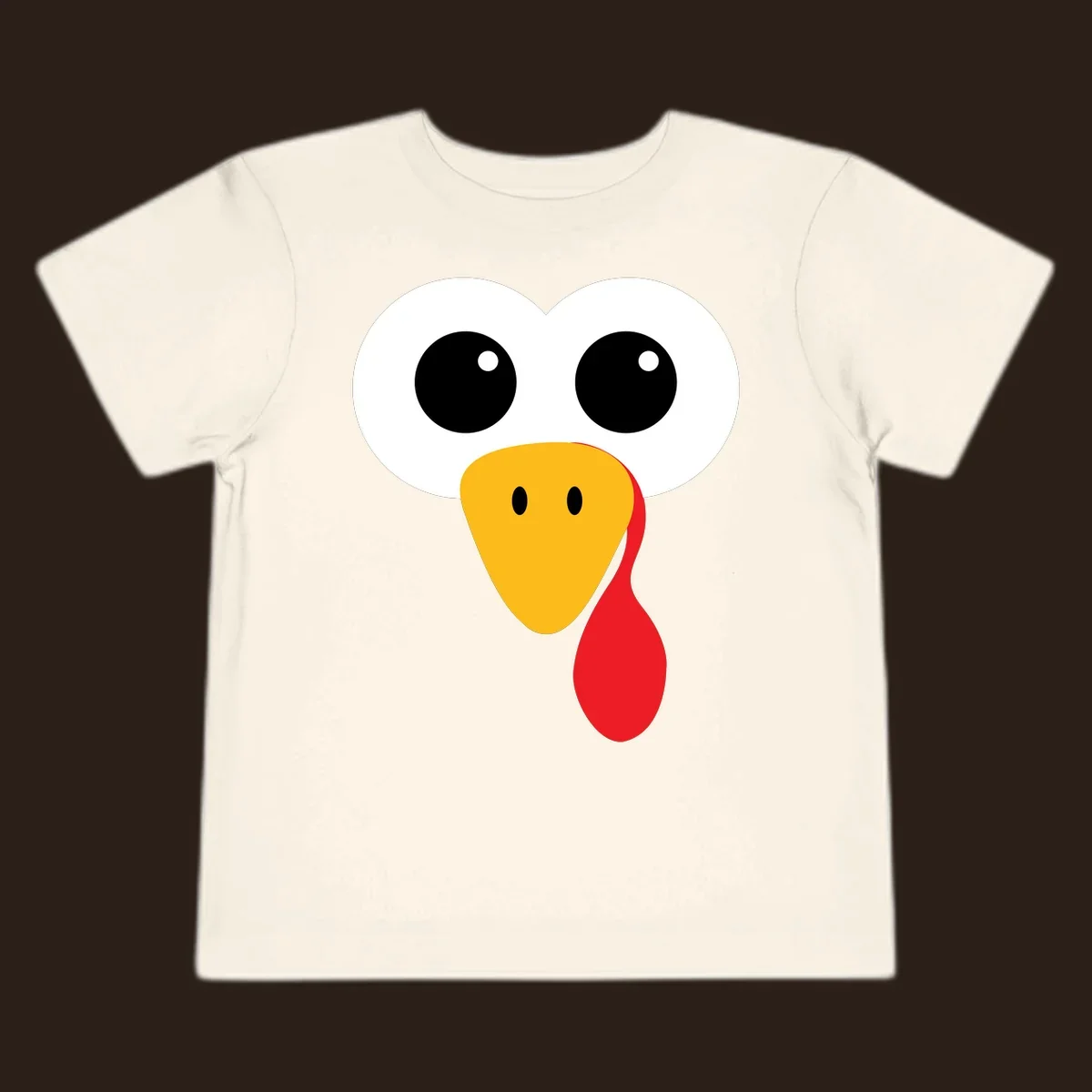 Funny turkey face with googly eyes, yellow beak, and red wattle for Thanksgiving.