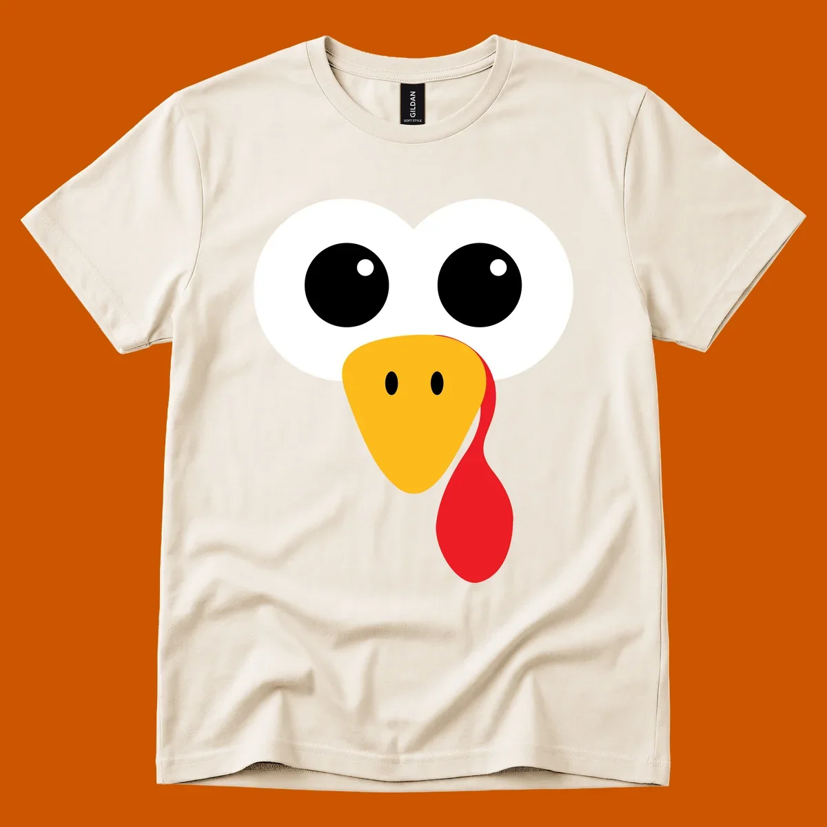 Funny turkey face with googly eyes, yellow beak, and red wattle for Thanksgiving.