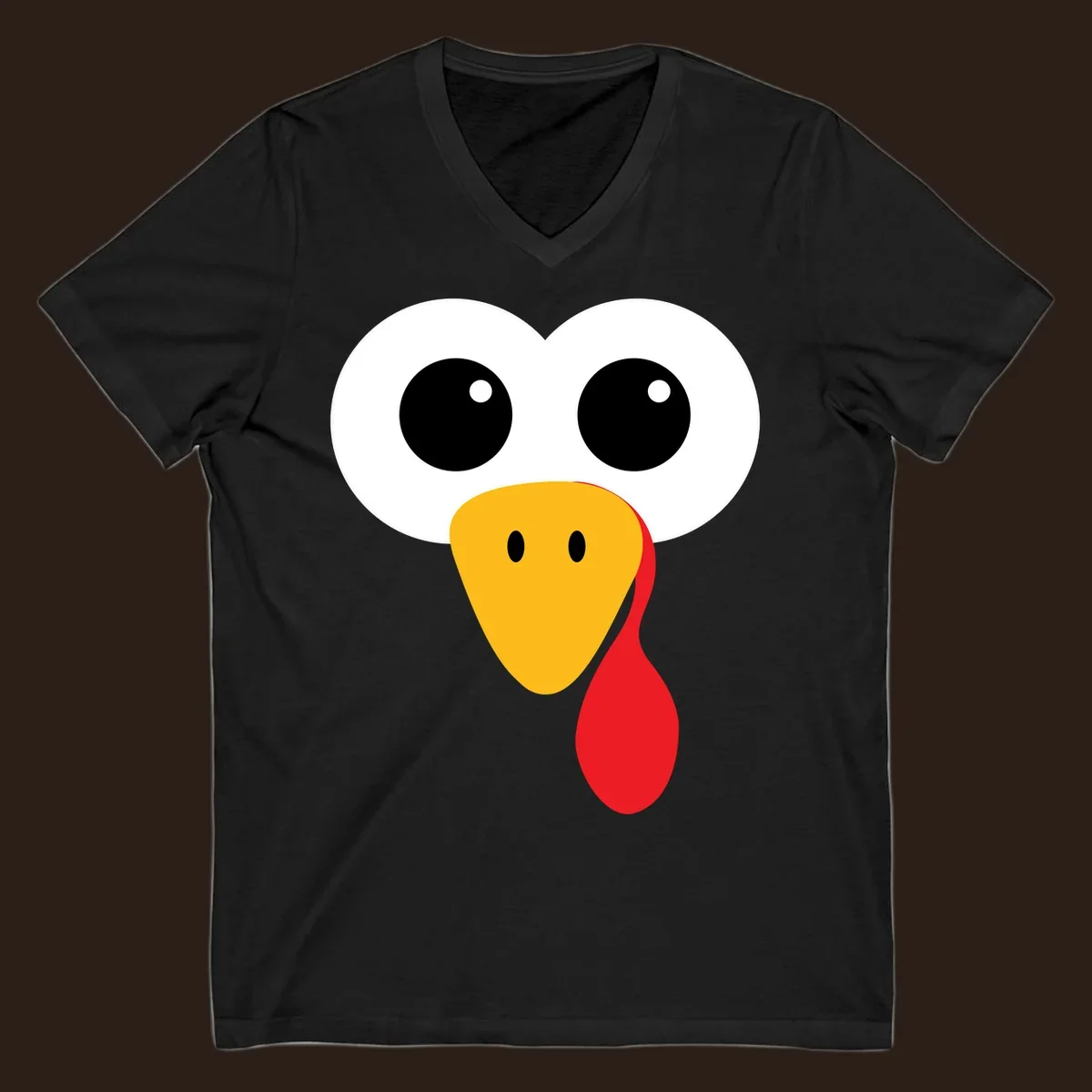Funny turkey face with googly eyes, yellow beak, and red wattle for Thanksgiving.