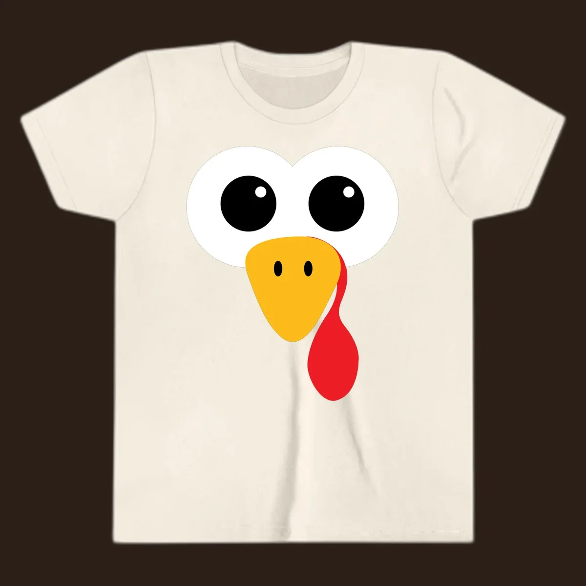 Funny turkey face with googly eyes, yellow beak, and red wattle for Thanksgiving.