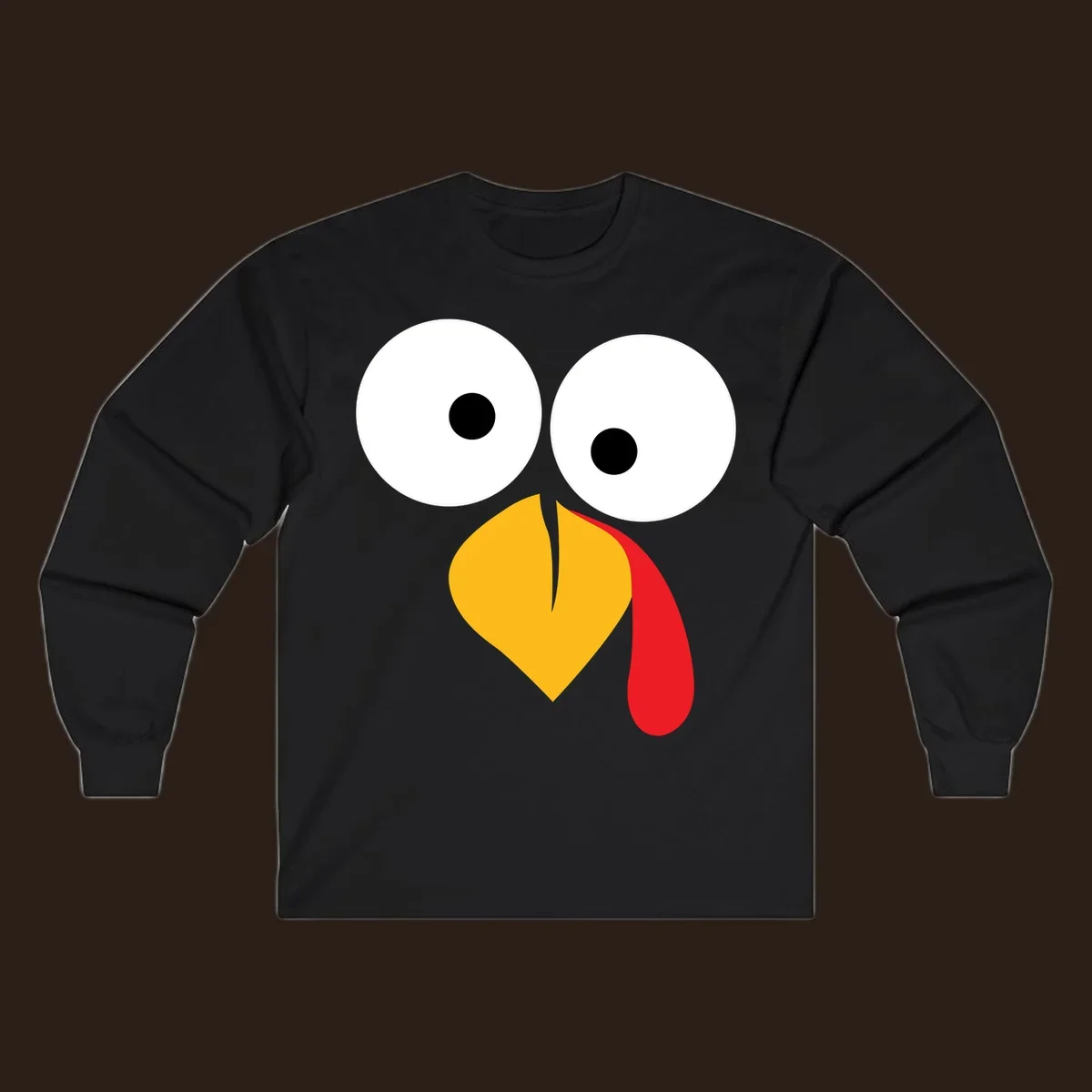 Googly-eyed turkey face illustration with yellow beak and red wattle.