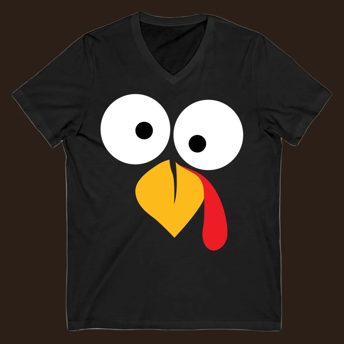 Googly-eyed turkey face illustration with yellow beak and red wattle.