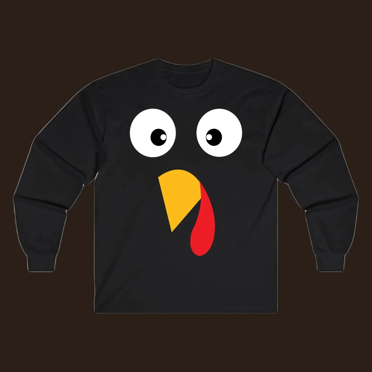 Googly eyed turkey face illustration with yellow beak and red wattle on black background.