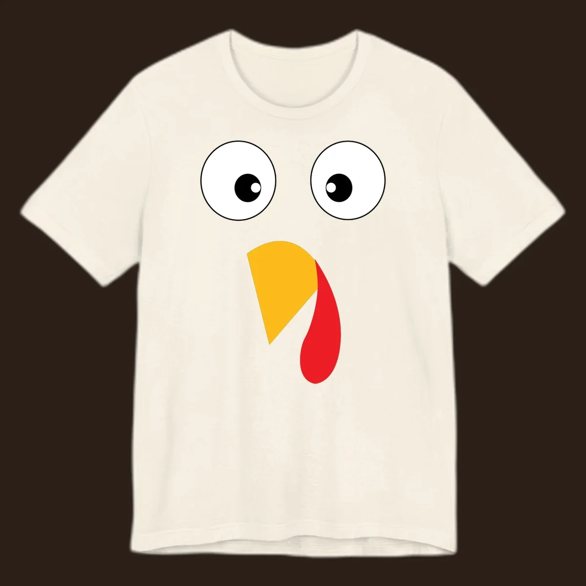 Googly eyed turkey face illustration with yellow beak and red wattle on black background.