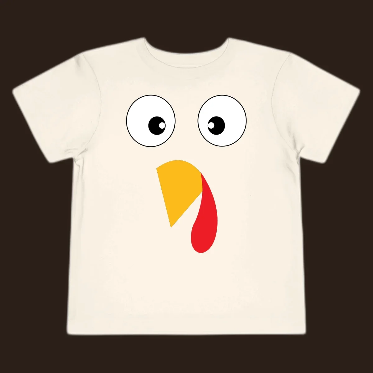 Googly eyed turkey face illustration with yellow beak and red wattle on black background.