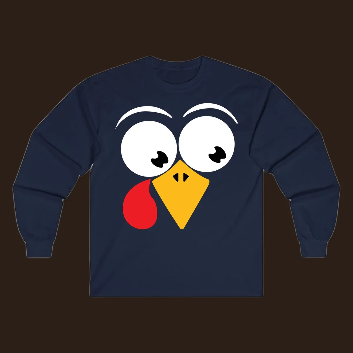 Googly eyed turkey face with yellow beak and red wattle on black background.