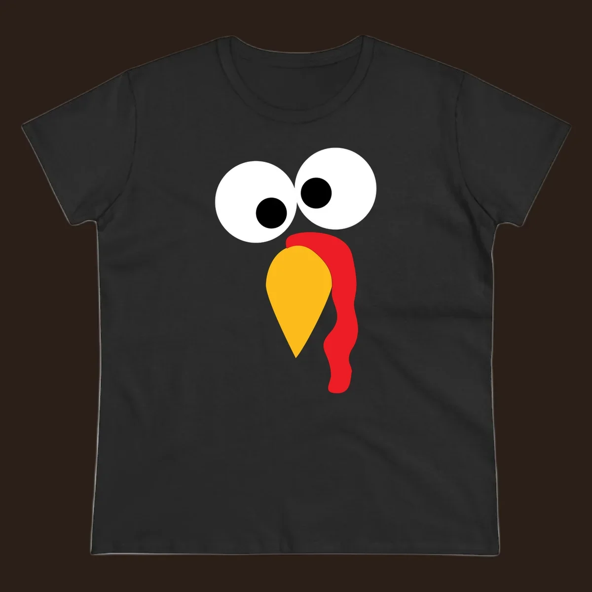 Googly-eyed turkey face illustration with yellow beak and red wattle.