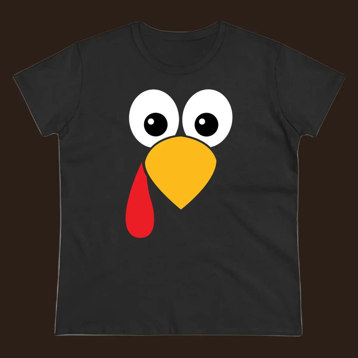 Funny turkey face illustration with big eyes, yellow beak, and red wattle for Thanksgiving.