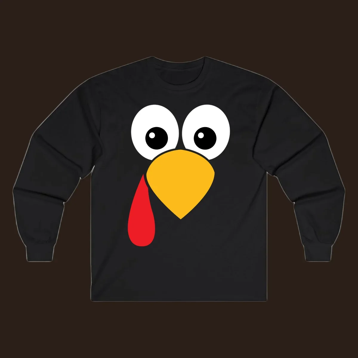 Funny turkey face illustration with big eyes, yellow beak, and red wattle for Thanksgiving.