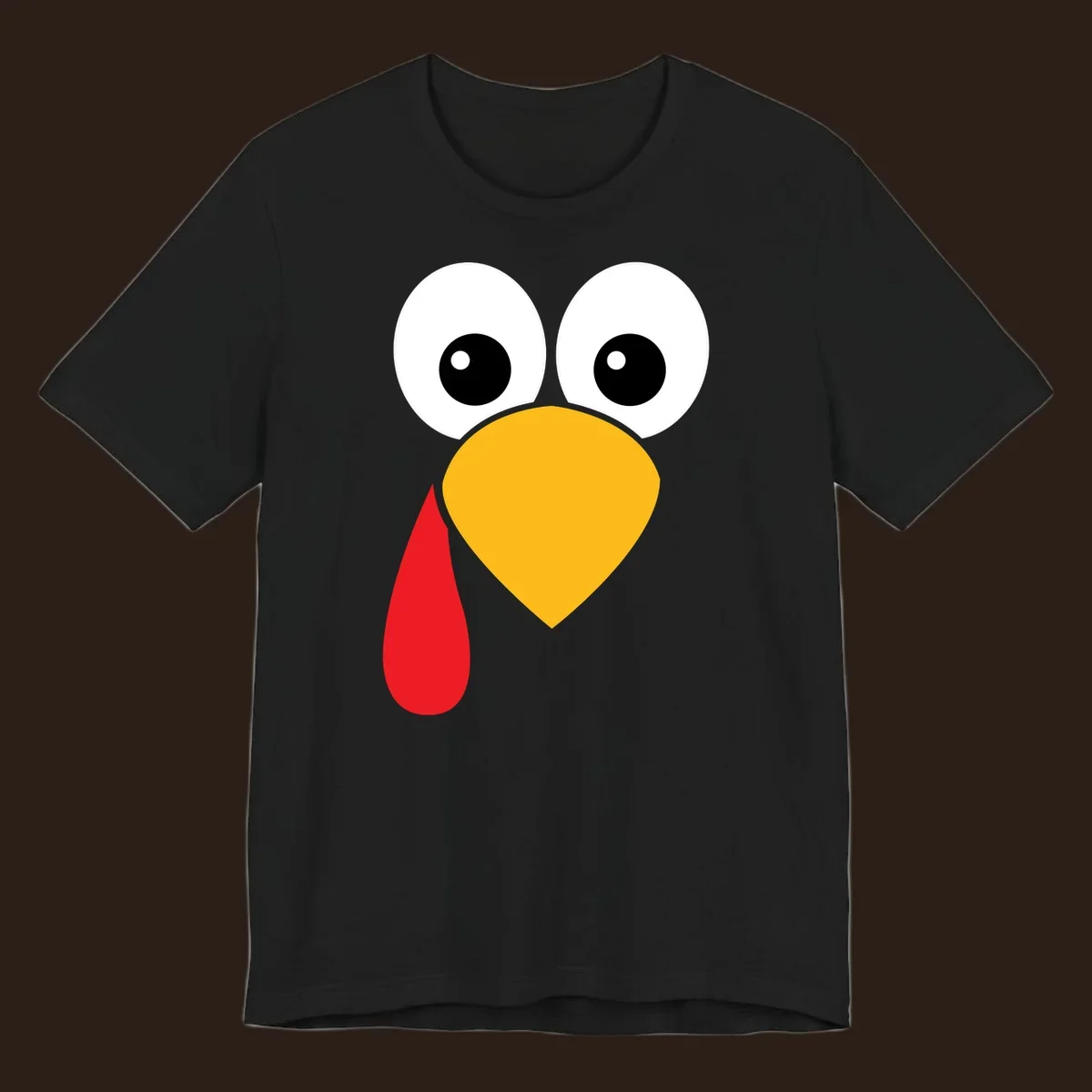 Funny turkey face illustration with big eyes, yellow beak, and red wattle for Thanksgiving.