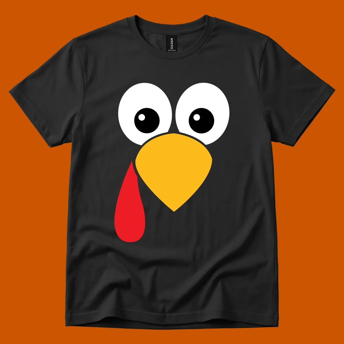 Funny turkey face illustration with big eyes, yellow beak, and red wattle for Thanksgiving.