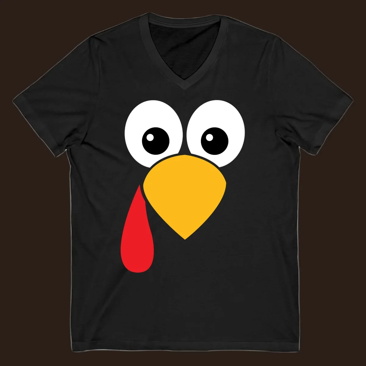 Funny turkey face illustration with big eyes, yellow beak, and red wattle for Thanksgiving.
