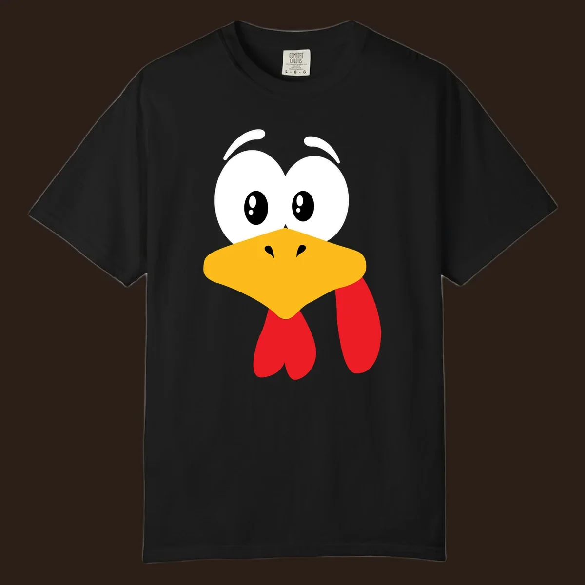 Funny cartoon turkey face graphic with googly eyes and a yellow beak.