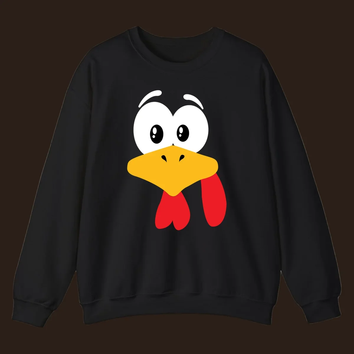 Funny cartoon turkey face graphic with googly eyes and a yellow beak.