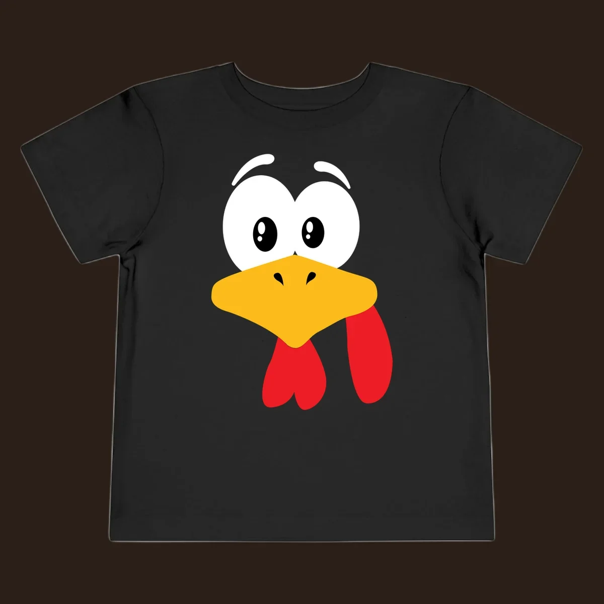 Funny cartoon turkey face graphic with googly eyes and a yellow beak.