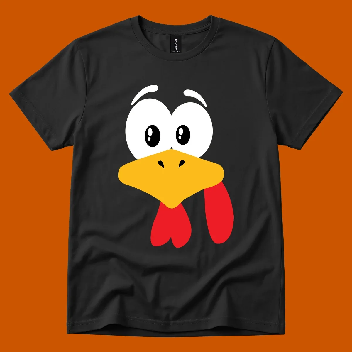 Funny cartoon turkey face graphic with googly eyes and a yellow beak.