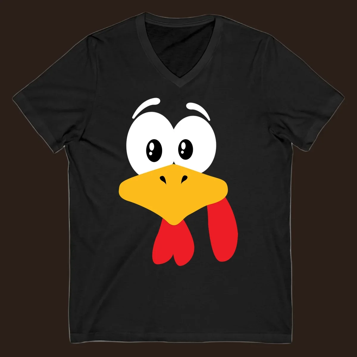 Funny cartoon turkey face graphic with googly eyes and a yellow beak.