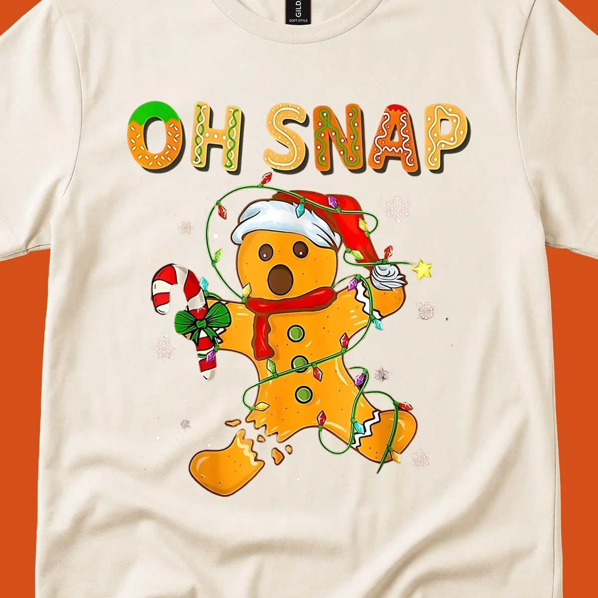 Oh snap gingerbread man tangled in christmas lights broken in half with text, funny holiday design.