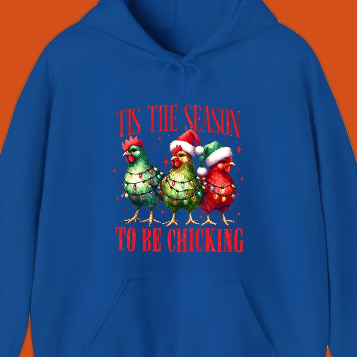 Christmas chickens wearing Santa hats and decorated with lights, with text 'Tis The Season To Be Chicking'.