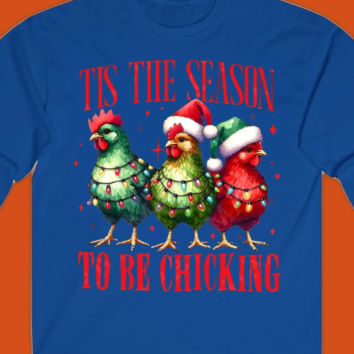 Christmas chickens wearing Santa hats and decorated with lights, with text 'Tis The Season To Be Chicking'.