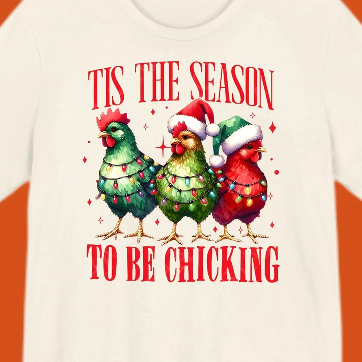 Christmas chickens wearing Santa hats and decorated with lights, with text 'Tis The Season To Be Chicking'.