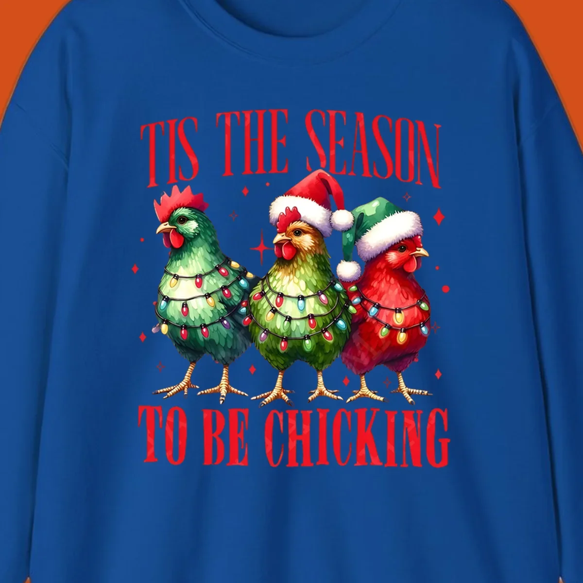 Christmas chickens wearing Santa hats and decorated with lights, with text 'Tis The Season To Be Chicking'.