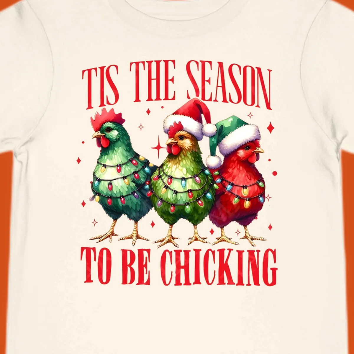 Christmas chickens wearing Santa hats and decorated with lights, with text 'Tis The Season To Be Chicking'.