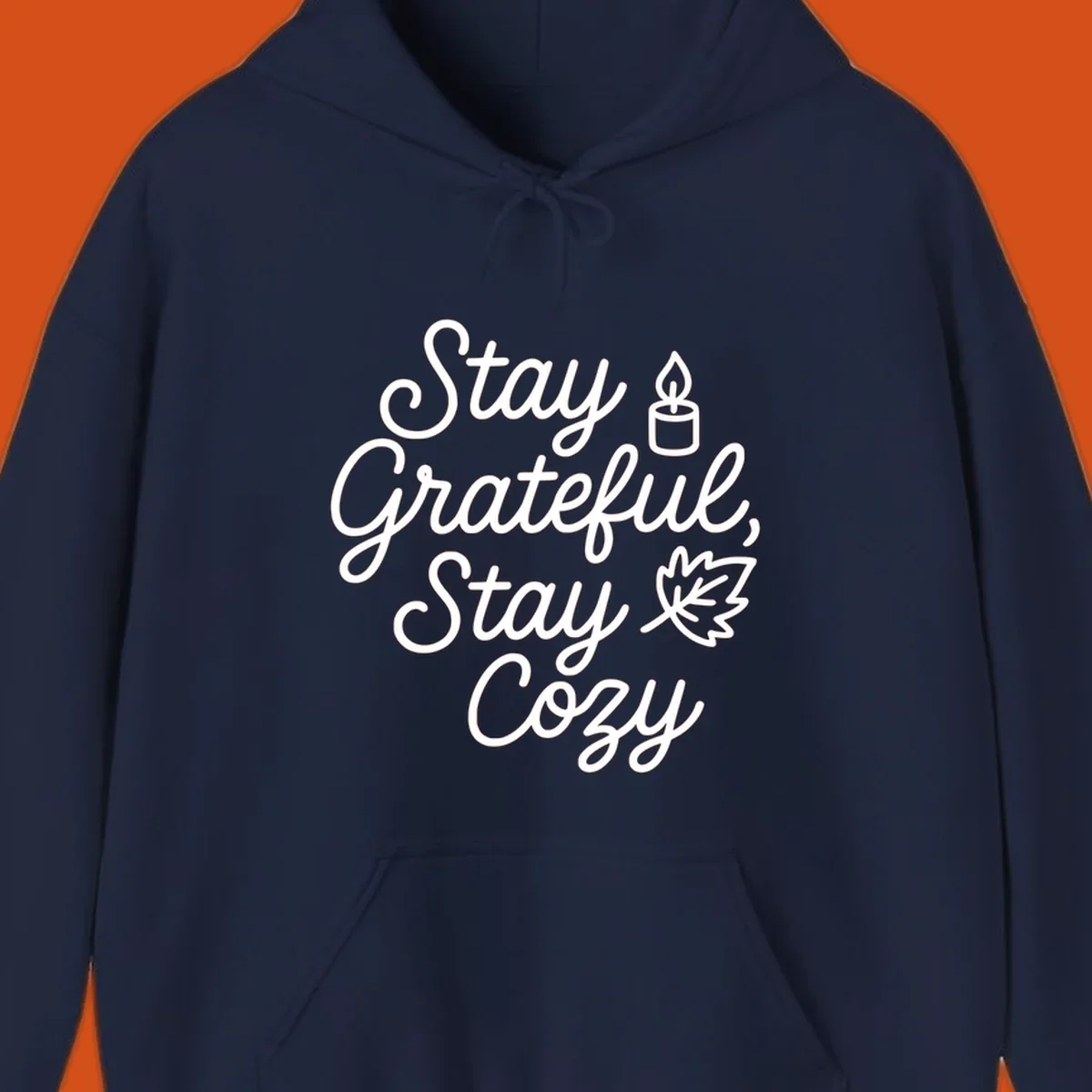 Text design with 'Stay Grateful, Stay Cozy' phrase, candle, and leaf for grateful-cozy-fall theme.