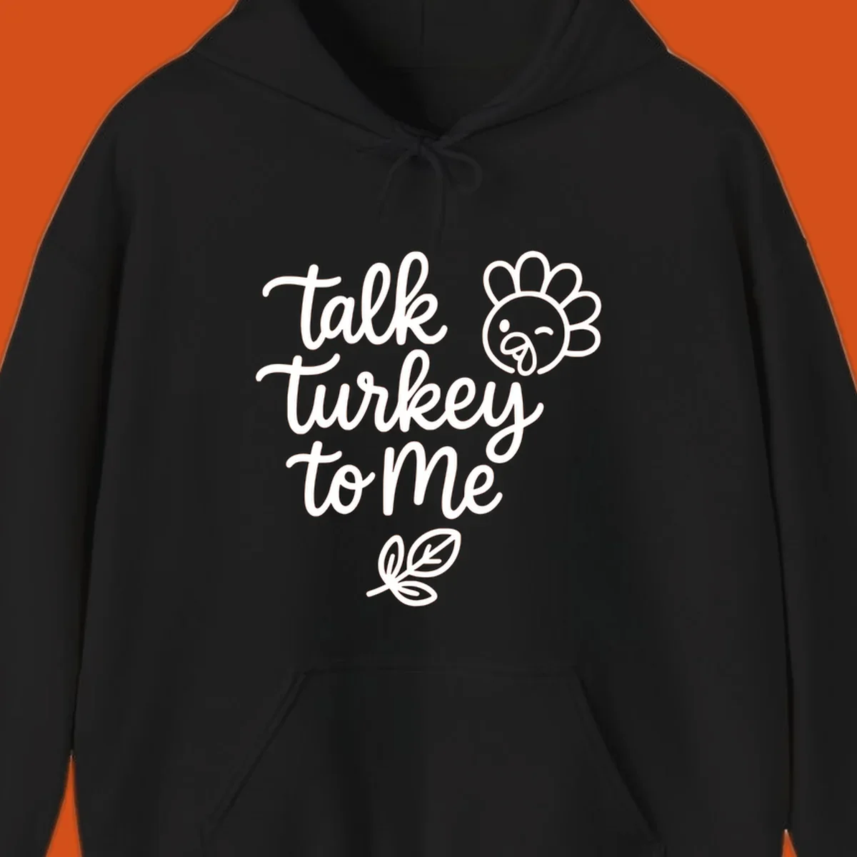 Talk Turkey To Me Thanksgiving phrase with cartoon turkey and leaf illustration.