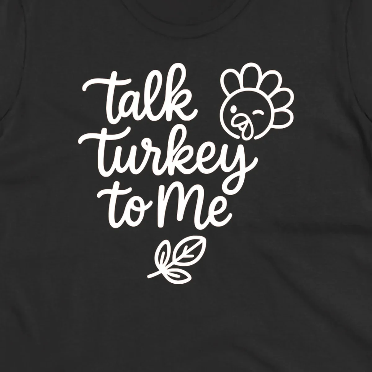 Talk Turkey To Me Thanksgiving phrase with cartoon turkey and leaf illustration.