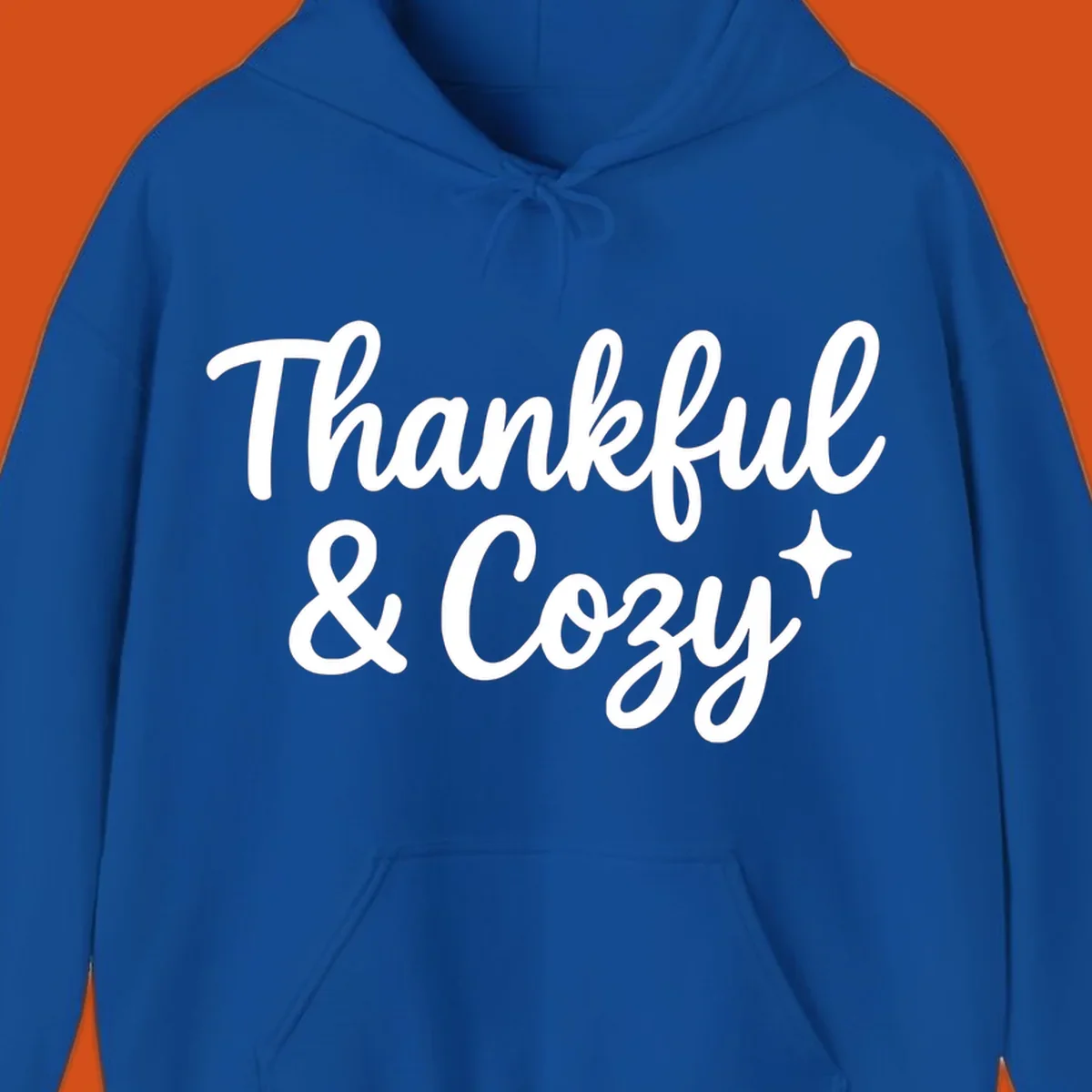 Thankful and cozy script text with starburst design.