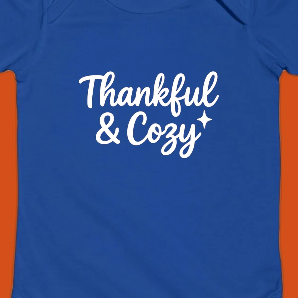 Thankful and cozy script text with starburst design.