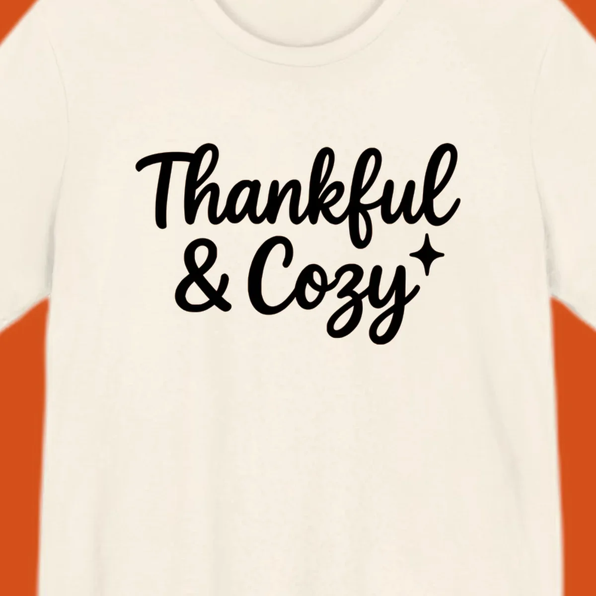 Thankful and cozy script text with starburst design.