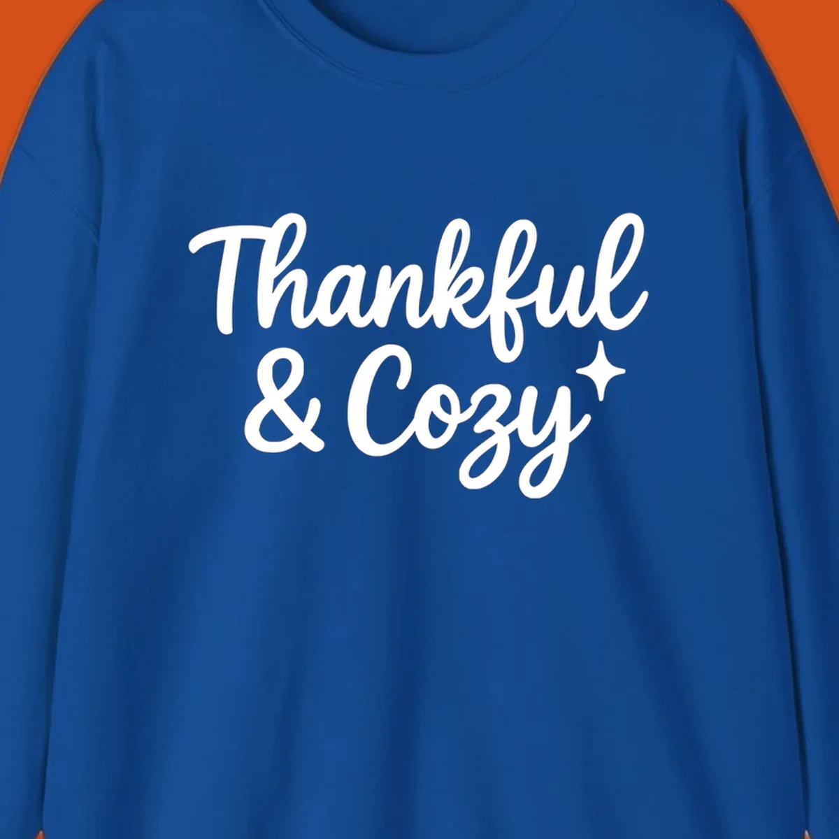 Thankful and cozy script text with starburst design.