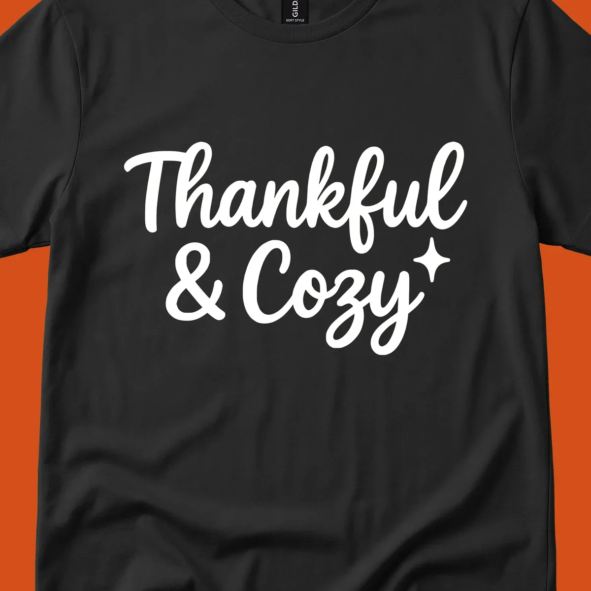 Thankful and cozy script text with starburst design.